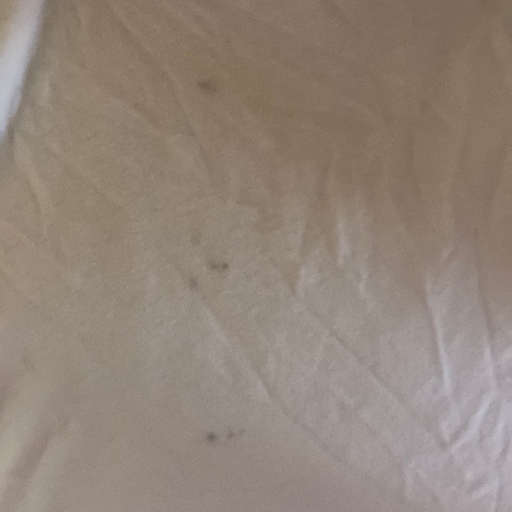 Minimal marks from the lululemon white Tee